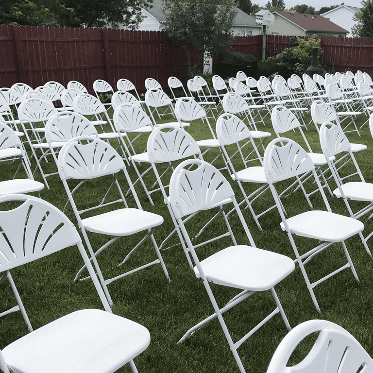 fanback chairs aligned in backyard
